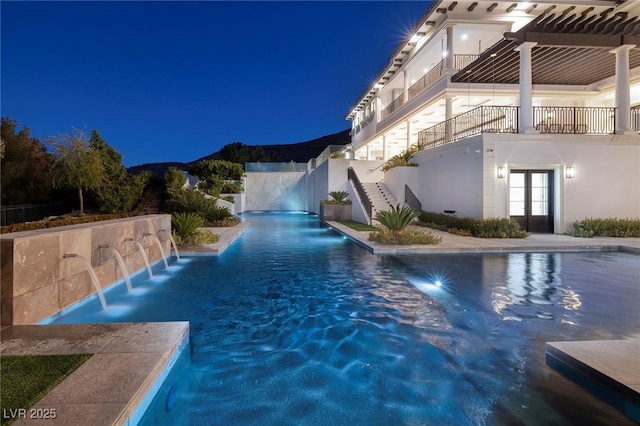 view of pool with stairway and a fenced in pool