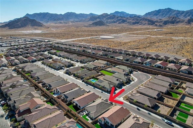 birds eye view of property featuring a mountain view