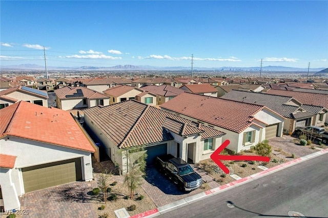 birds eye view of property with a mountain view