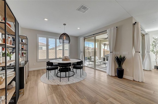 dining space featuring light hardwood / wood-style flooring