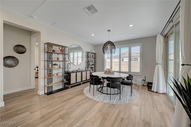 dining room with light hardwood / wood-style floors