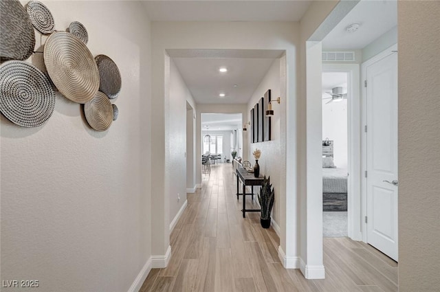 hallway featuring light wood-type flooring