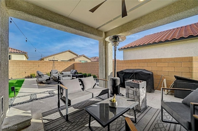 view of patio / terrace featuring ceiling fan, an outdoor living space, and area for grilling