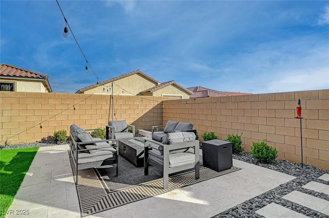 view of patio / terrace with an outdoor living space with a fire pit