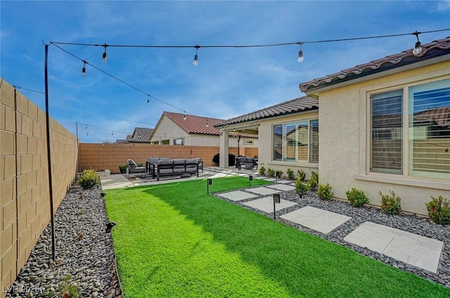 view of yard featuring an outdoor hangout area and a patio