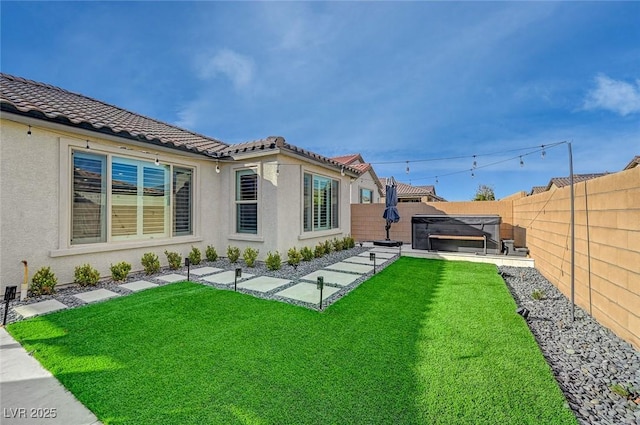 rear view of property featuring a yard