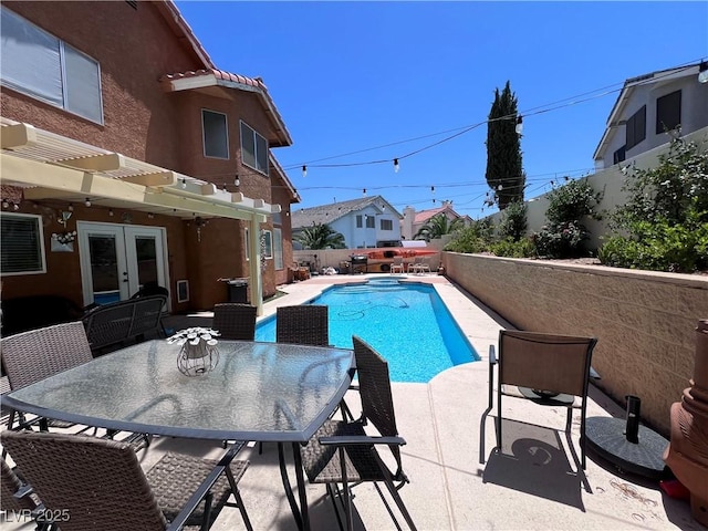 view of pool featuring french doors, a pergola, and a patio