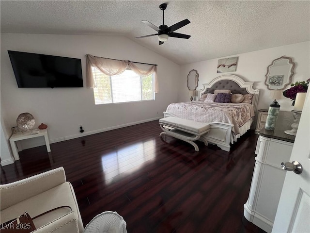 bedroom with dark hardwood / wood-style flooring, ceiling fan, lofted ceiling, and a textured ceiling