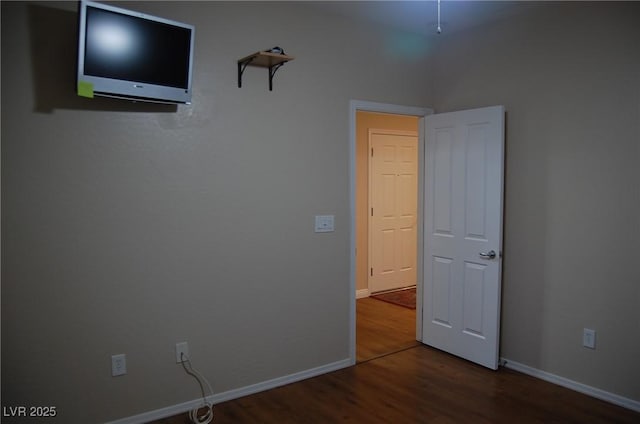 unfurnished bedroom featuring hardwood / wood-style flooring