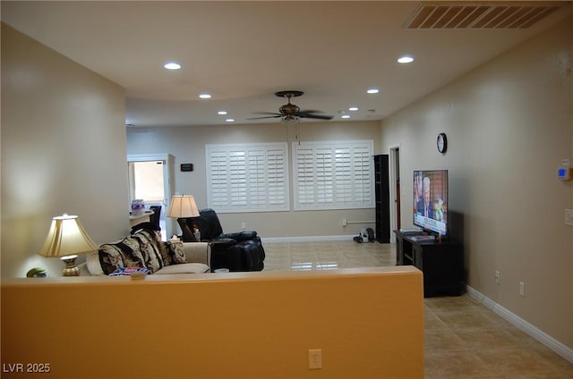 home office featuring light tile patterned flooring and ceiling fan