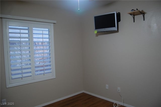 unfurnished room with wood-type flooring