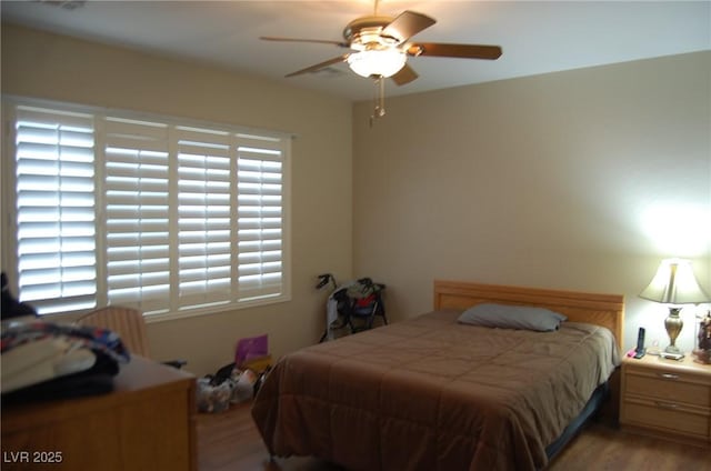 bedroom featuring ceiling fan and light hardwood / wood-style flooring