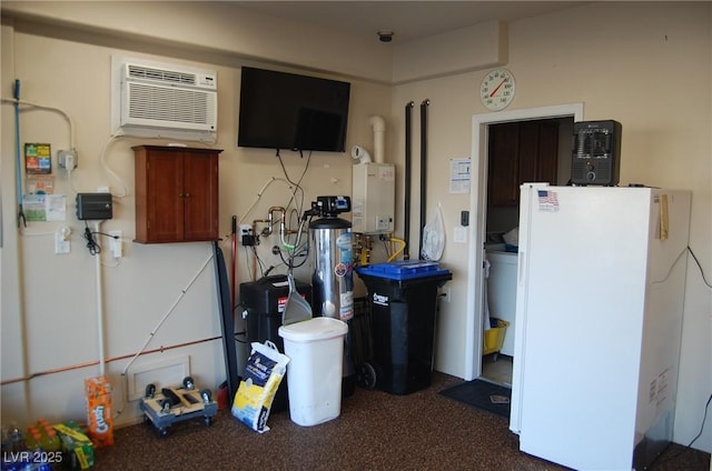 garage with a wall mounted AC and white fridge