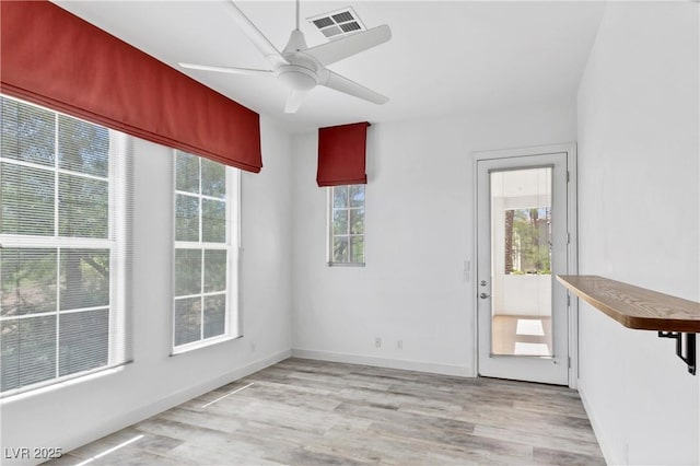 interior space featuring ceiling fan and light wood-type flooring