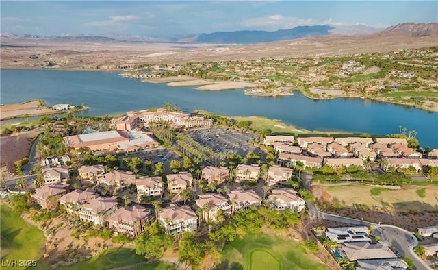 aerial view featuring a water and mountain view