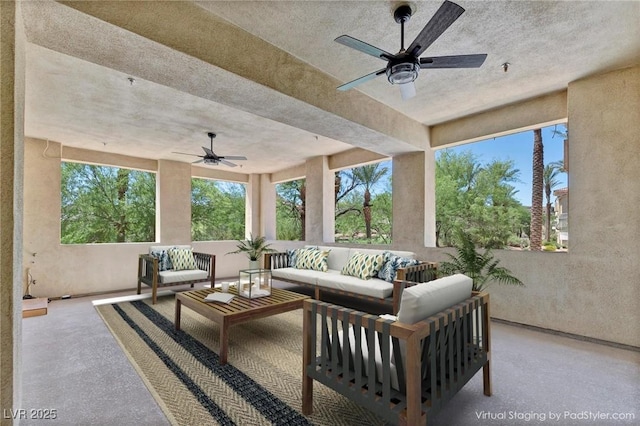 view of patio with ceiling fan and an outdoor living space