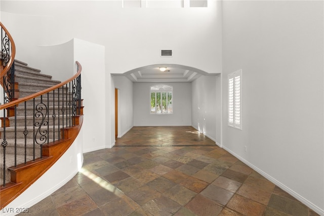 foyer entrance featuring a tray ceiling