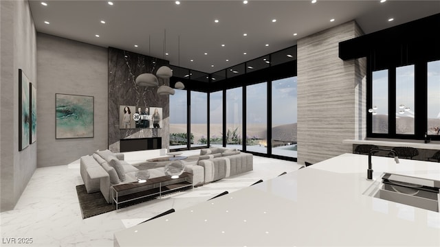 bedroom with access to exterior, a towering ceiling, and floor to ceiling windows