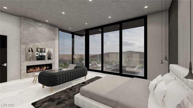 bedroom with a premium fireplace, access to outside, and floor to ceiling windows