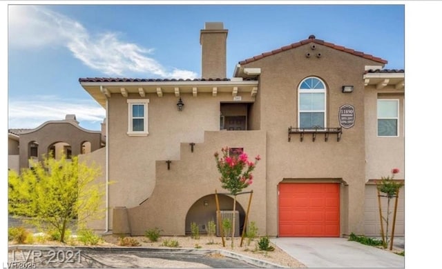 back of property featuring a garage