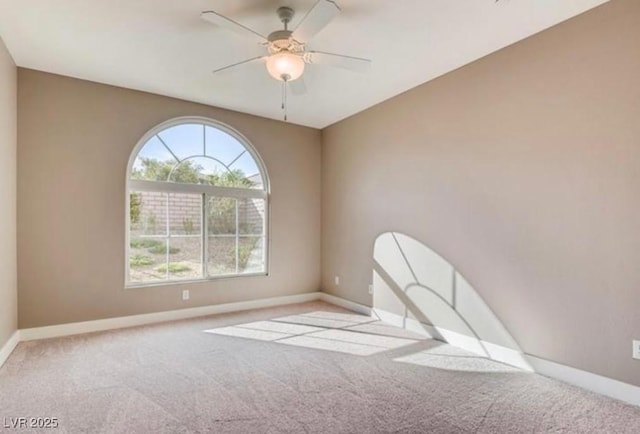 carpeted empty room with ceiling fan