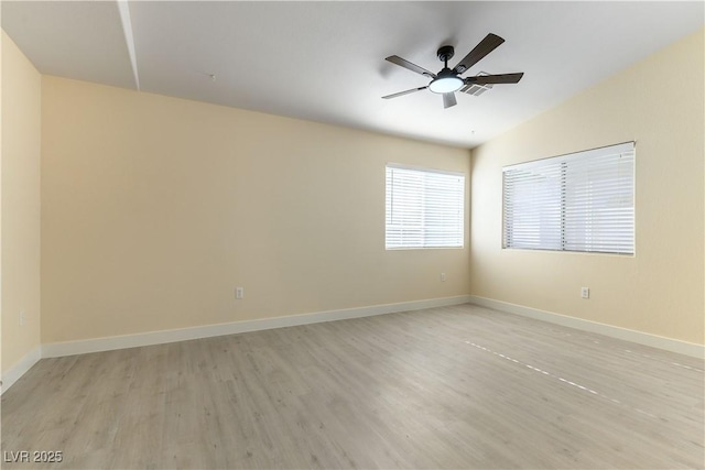 empty room featuring ceiling fan and light hardwood / wood-style floors