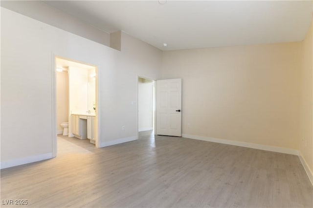 unfurnished room with light hardwood / wood-style flooring