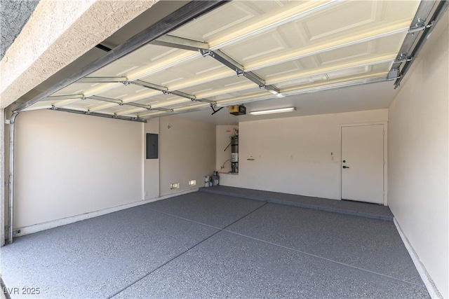 garage featuring a garage door opener and electric panel