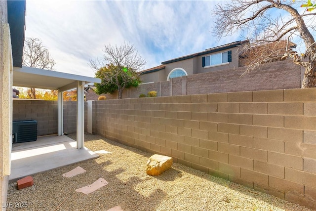 view of yard featuring a patio area and central air condition unit