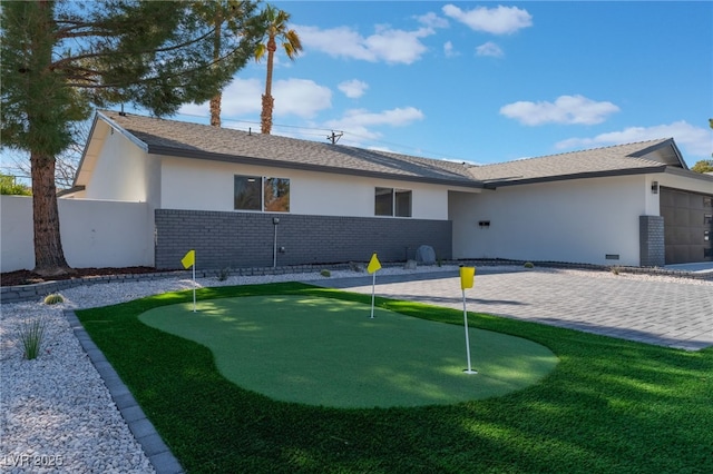 back of property with a patio