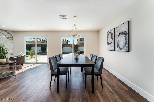 dining room featuring dark hardwood / wood-style flooring