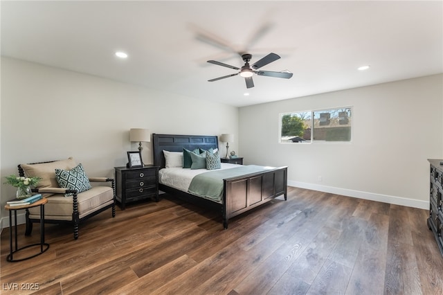 bedroom with dark hardwood / wood-style floors and ceiling fan