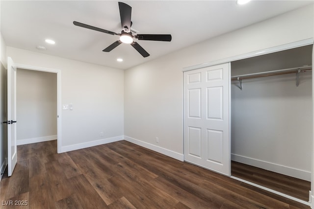 unfurnished bedroom with ceiling fan, dark hardwood / wood-style flooring, and a closet