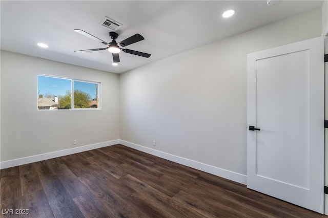 unfurnished room with dark hardwood / wood-style floors and ceiling fan