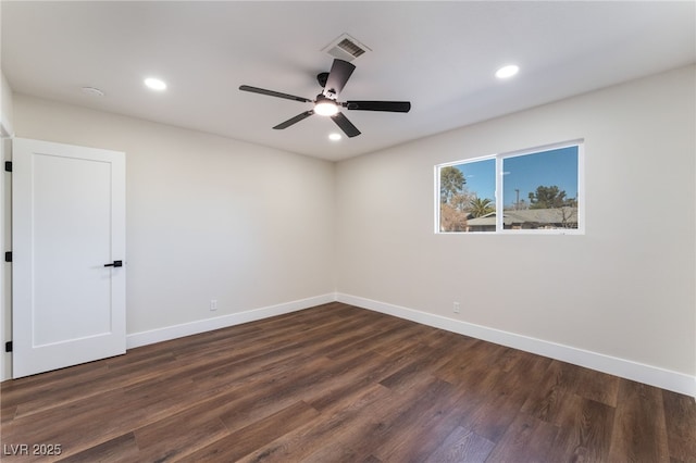 empty room with dark wood-type flooring and ceiling fan