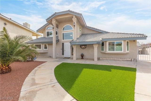 rear view of house with a lawn