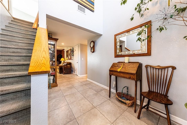 hallway with tile patterned flooring