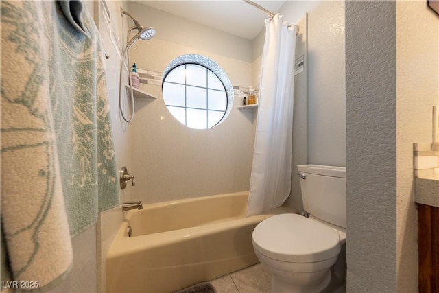 full bathroom with shower / tub combo with curtain, tile patterned floors, toilet, and vanity