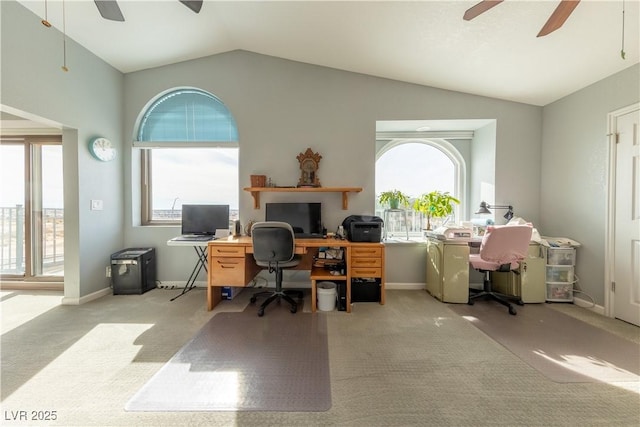 carpeted office space with lofted ceiling, plenty of natural light, and ceiling fan