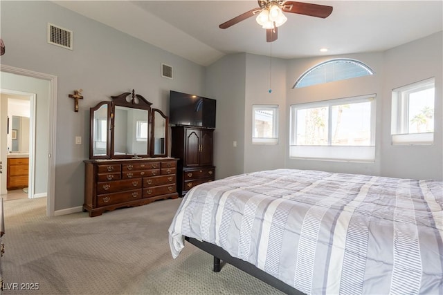 carpeted bedroom featuring ceiling fan and vaulted ceiling