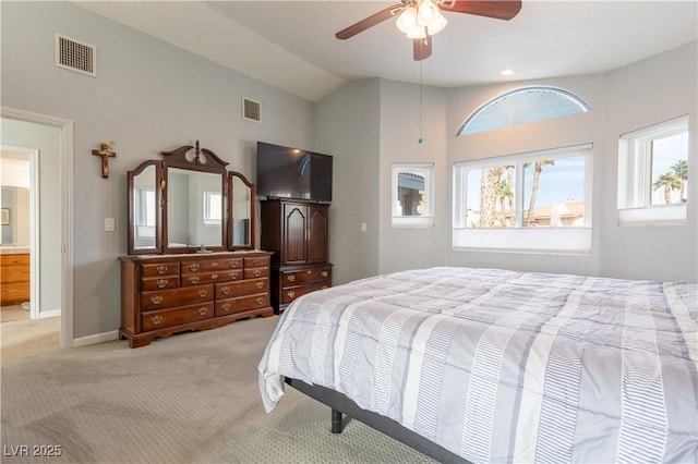 bedroom featuring vaulted ceiling, light colored carpet, and ceiling fan