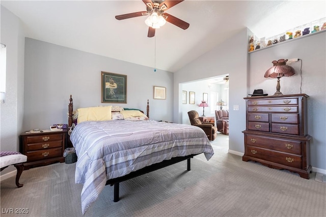 carpeted bedroom featuring lofted ceiling and ceiling fan