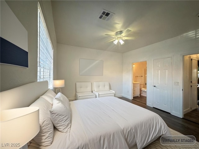 4730 E Craig Rd Unit 1172, Las Vegas, NV 89115 - bedroom with dark wood-style floors, ensuite bath, baseboards, and a ceiling fan