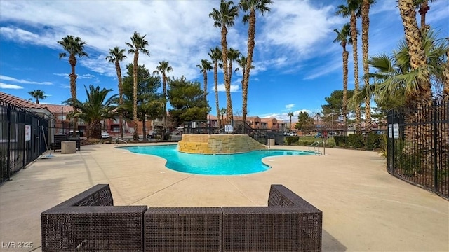 view of swimming pool with a patio area