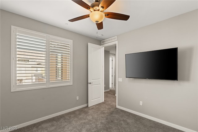 unfurnished bedroom with ceiling fan and carpet flooring