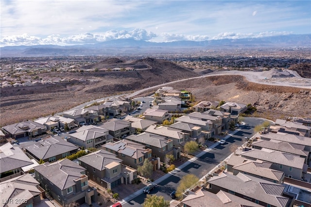 birds eye view of property featuring a mountain view