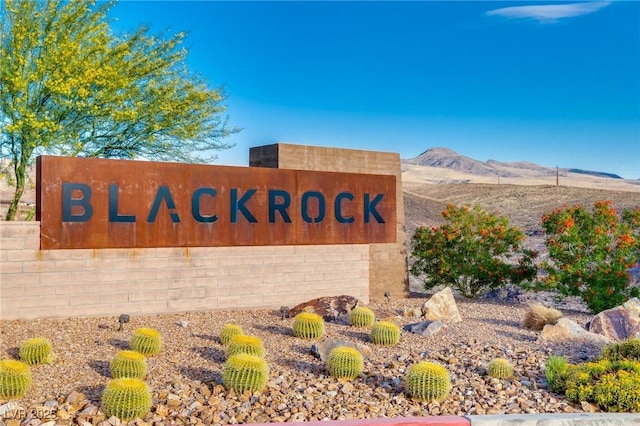 community sign featuring a mountain view