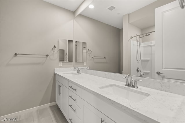 bathroom featuring vanity and walk in shower