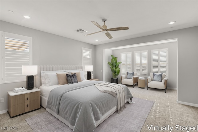 bedroom with light colored carpet and ceiling fan