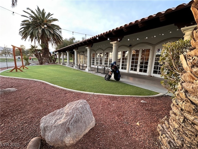 surrounding community featuring a patio area and a lawn